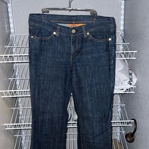 Tory Burch Blue Jeans with gold colored hardware.